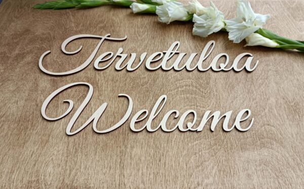 Tervetuloa/Welcome- vaneriteksti